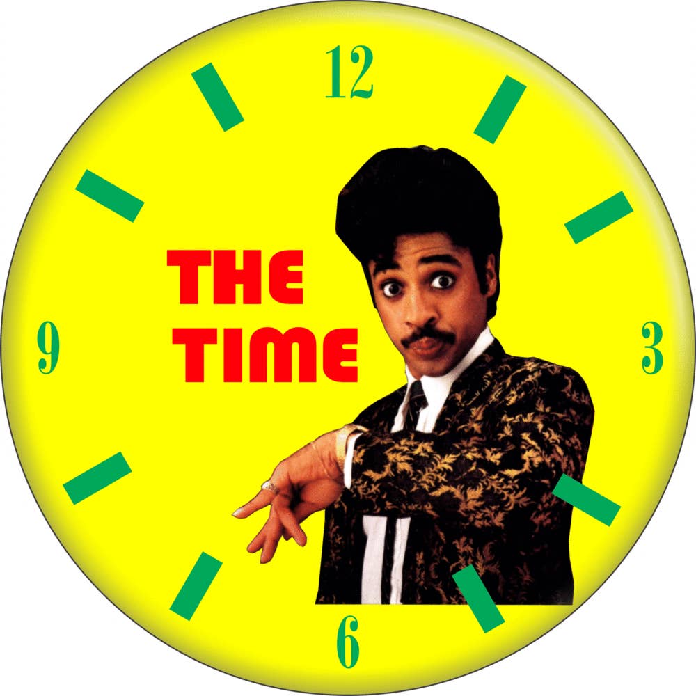 1 1/4” round pinback button of bright yellow clock with green hands and Morris Day portrait 