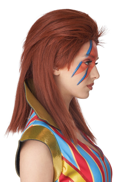 A woman wearing a red hair wig styled like David Bowie's Ziggy Stardust style auburn red hair, with orange and blue face paint, a gold cape collar, and a red, blue, and yellow striped costume top against a white background. Shown from side