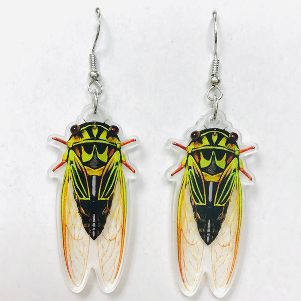 acrylic green Cicada-shaped dangle earrings on a white background