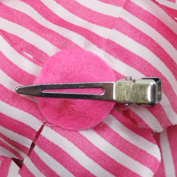 Pink and white striped rose-shaped fabric hair clip on a white background. Alligator clip shown