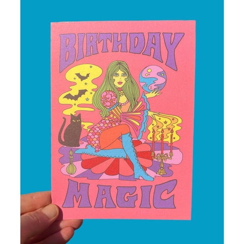 Colorful birthday card with a psychedelic art style witch design and 'Birthday Magic' text on a pink background.
