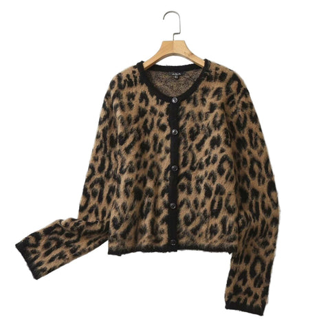 jacquard knit brown and black leopard print cardigan with round neckline and black button front shown from front on a hanger 