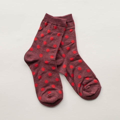 cotton knit socks in a heathered burgundy with an allover orangey red polka dot knit-in pattern