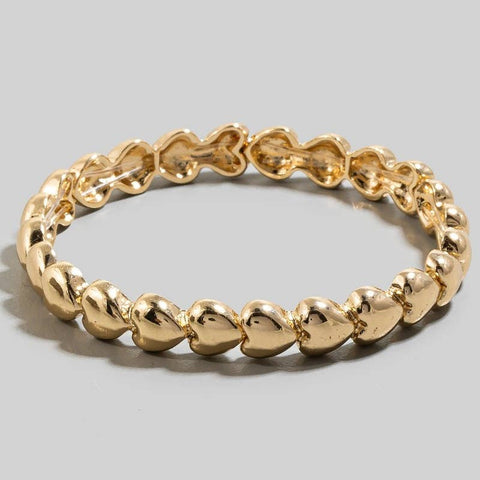stretch bracelet made of small segments of gold metal hearts