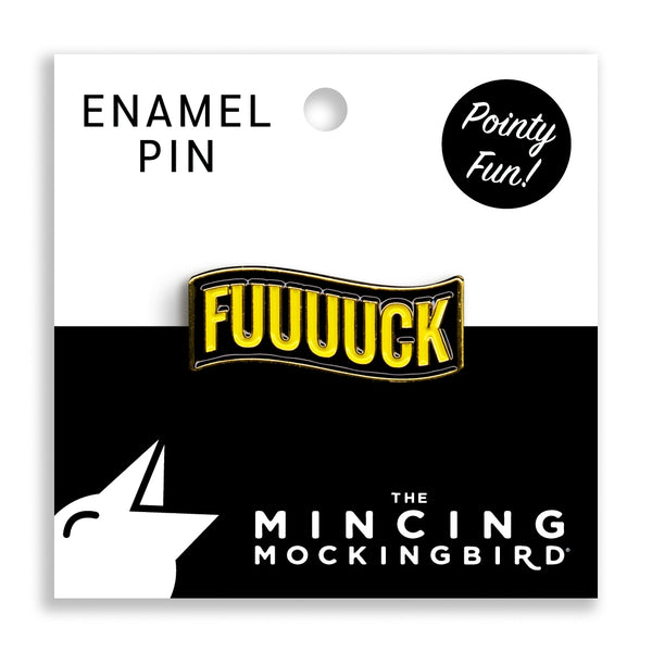 gold metal enamel pin of wavy banner shape with black background and "FUUUUCK" in yellow capital letters. Shown on branded backing card