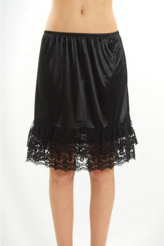 Model wearing a black nylon half slip with elasticized waist and a double tiered black floral lace bottom hem. Shown from the front