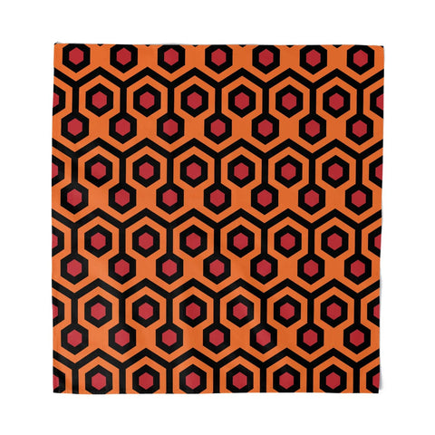 square scarf with black, orange, and red hexagonal pattern of Overlook Hotel carpet as seen in The Shining