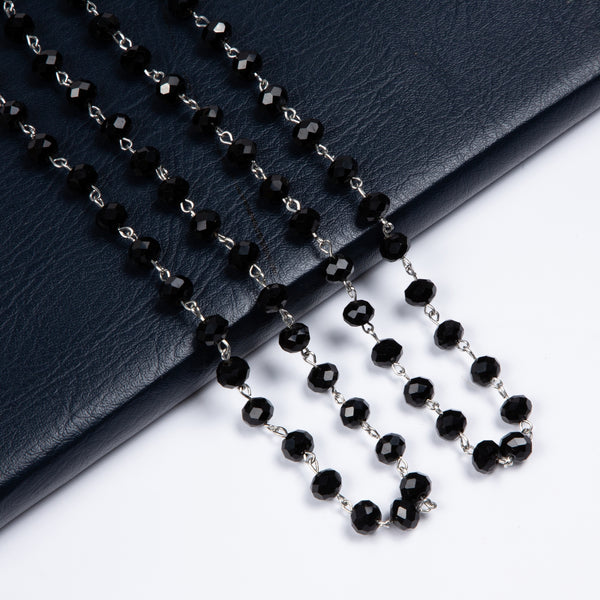 jet black round faceted glass linked bead strand necklace in 60" length. Shown doubled in close up