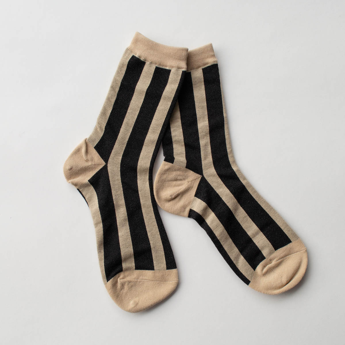 cotton knit crew socks in beige with a sleek black lurex vertical stripe pattern