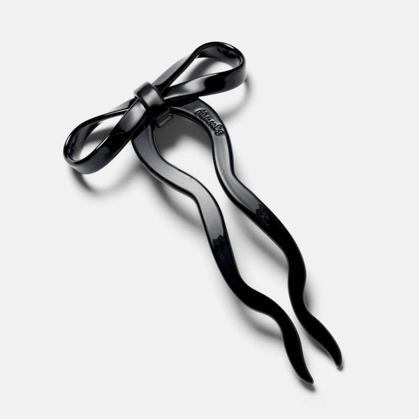 5 1/2" black acetate bow shaped hairpin. Shown flat