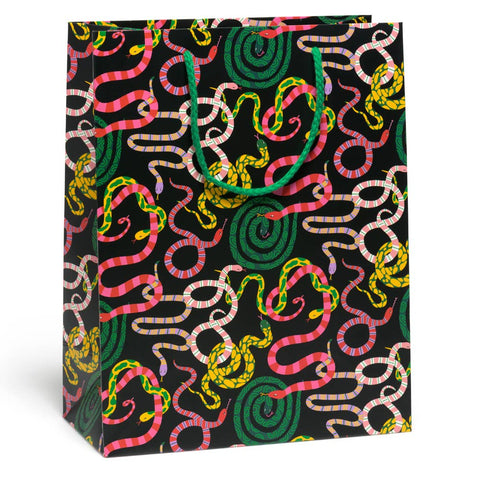 Rectangular gift bag with multicolored allover pattern of green, red, pink, yellow, and purple snakes on a black background. With green cotton handles