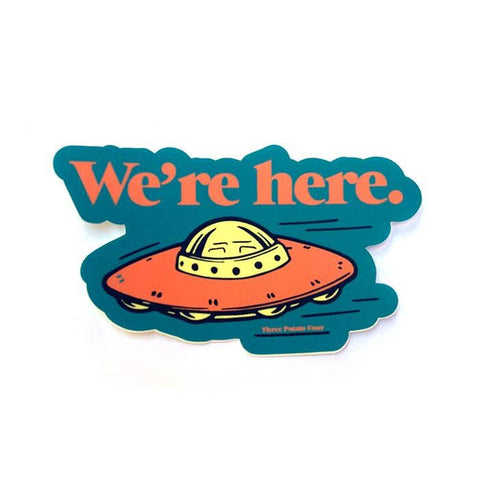 matte finish die cut vinyl sticker with image of retro yellow and orange spaceship on teal background with message "We're here." in orange