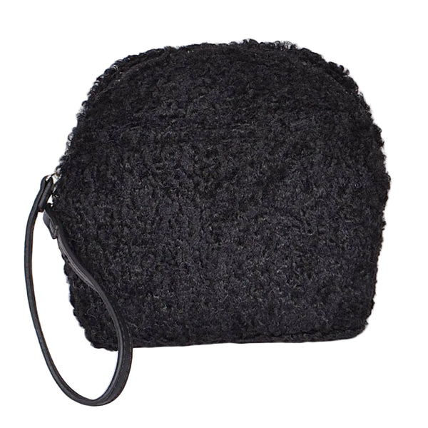 Black textured bouclé faux fur wristlet bag with a curved top and a black faux leather wrist strap, shown from front