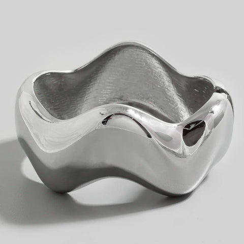 wavy shaped silver metal bangle with hinge closure