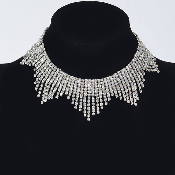 collar necklace made of five triangles of clear rhinestones inset in silver metal. Shown on dress form