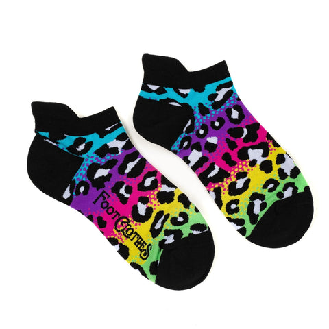 Neon blue, purple, pink, yellow, and green gradient leopard print ankle socks with black cuffs, toes, and heels. Shown flat