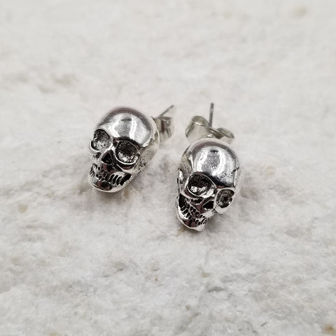 pair Small, nicely detailed shiny silver metal skull post earrings