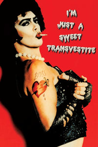 Rectangular postcard of Dr. Frank N. Furter posing from the side on a red background with the caption "I'M JUST A SWEET TRANSVESTITE"