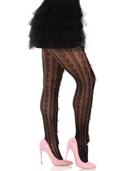 Model wearing striped black net pantyhose with heart knit-in detail and small baby pink satin bows running down the middle of the open peekaboo panels of each leg. Shown from the side