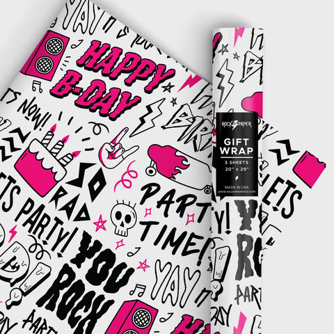 Roll of pink, black, and white heavyweight matte finish wrapping paper with all-over print of sketch style cakes, speakers, music notes, skulls, popsicles, and rock hands with phrases such as “HAPPY B-DAY” “PARTY TIME!” “SO RAD” “YOU ROCK”