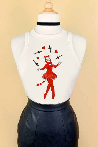 fitted off white ribbed crop tank top with round neckline and print of a pinup-style devil girl juggling black daggers and red hearts shown on a dress form tucked into black leather skirt