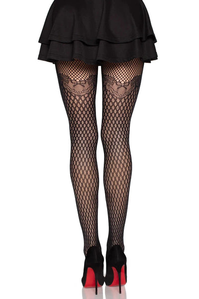 back view of a model wearing black diamond net tights and a short black skirt on a white background