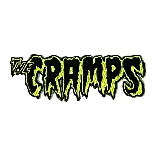 Logo of 'The Cramps' in black and green with a jagged text effect on a white background