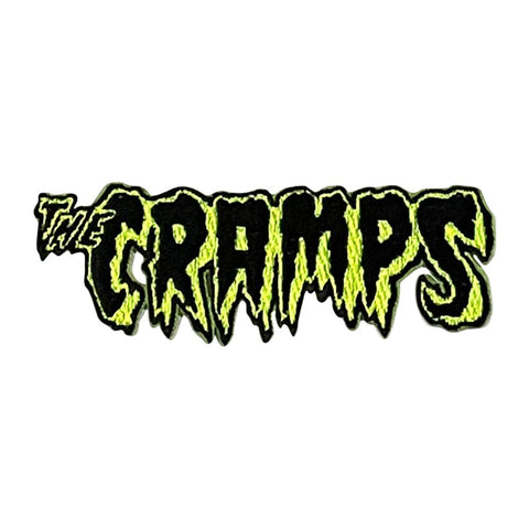 Logo of 'The Cramps' in black and green with a jagged text effect on a white background