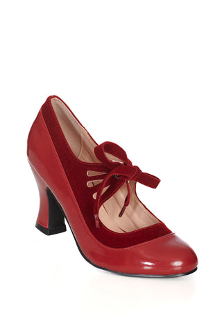 round-toed burgundy patent pump style shoe with a 3" heel height and featuring burgundy velvet teardrop cutout detail straps across the instep fastened with matching soft velvet ribbon ties