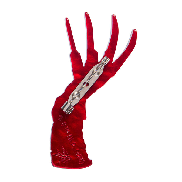 nightmare on elm street freddy krueger character's glove and arm in red and green striped sweater layered acrylic resin brooch, showing red back view with silver metal pin clasp