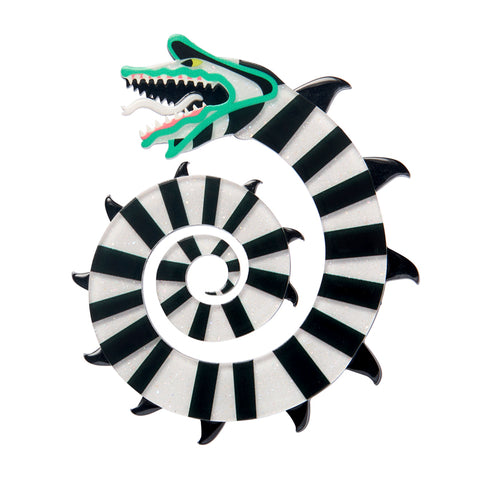 layered acrylic resin brooch of a coiled black and white striped Beetlejuice Sandworm 