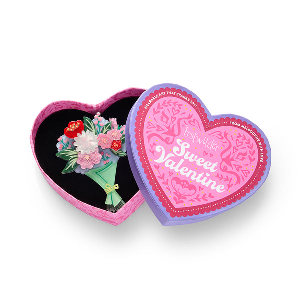 layered acrylic resin floral bouquet brooch, shown in illustrated heart-shaped box packaging
