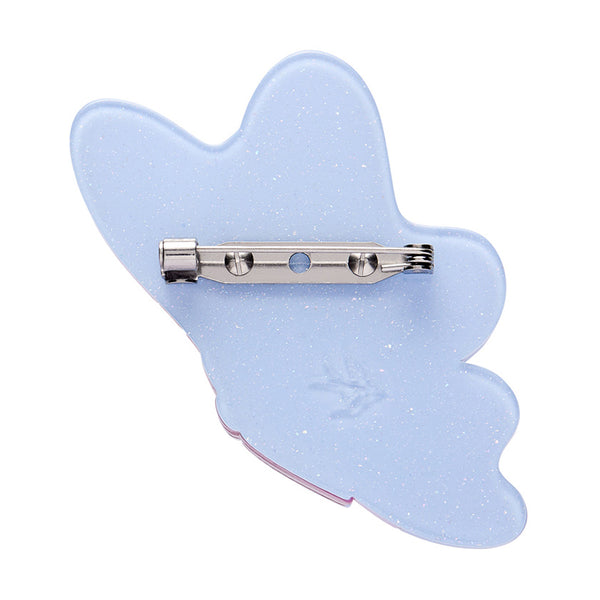 Colorful butterfly-shaped layered acrylic resin brooch with polka dot border, showing back view with silver metal pin clasp 