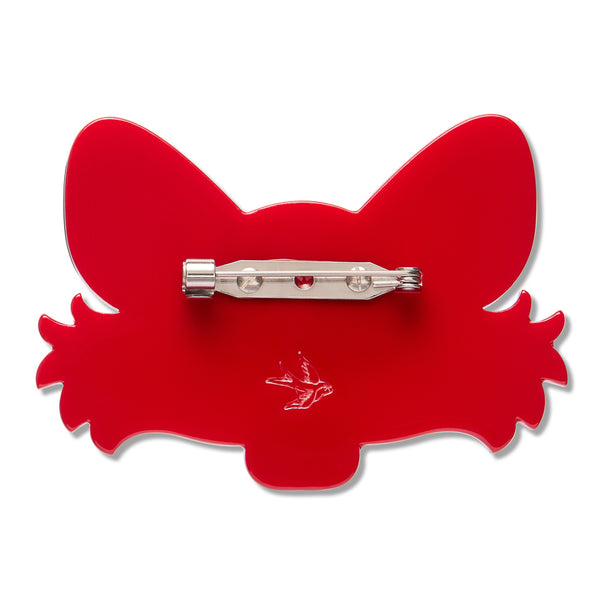 A bright red acrylic brooch shaped like a stylized fox head, shown from the back with a silver-tone metal pin clasp across the center.