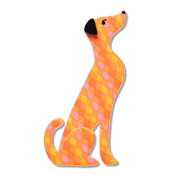 A stylized dog-shaped acrylic resin brooch featuring a geometric diamond pattern in orange, yellow, and pink, with a black nose and eyes, shown on a plain white background.