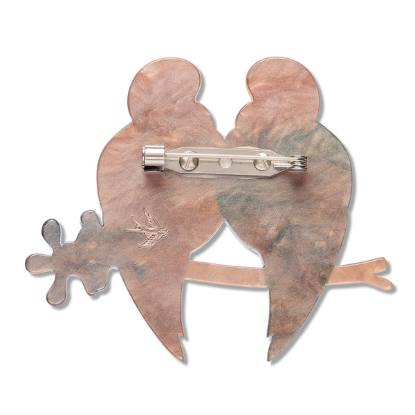 marbled light brown back view of pair of birds shaped brooch