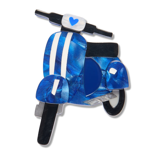 A scooter-shaped acrylic resin brooch featuring a blue marbled pattern with white stripes, a white headlight with a blue heart, and black handlebars, shown on a plain white background.