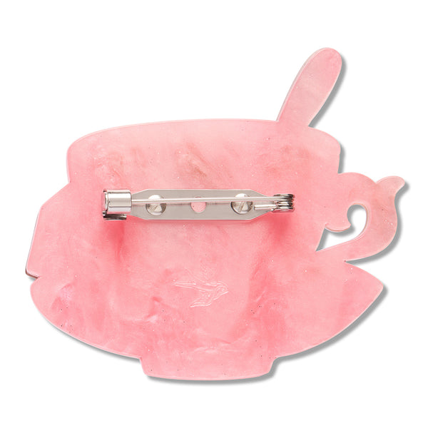 back view of marbled pink resin teacup and saucer shaped brooch