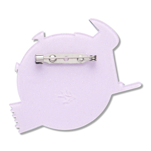 pale purple resin back layer of a full moon and witch's broom-shaped brooch with silver metal pin clasp fastener