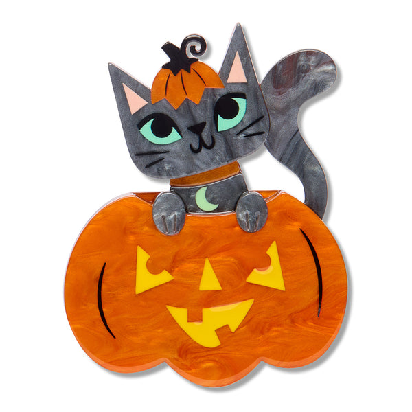 A Halloween-themed acrylic resin brooch featuring a gray cat with green eyes sitting inside a carved orange pumpkin, with a small orange pumpkin top as a hat and a crescent moon collar.
