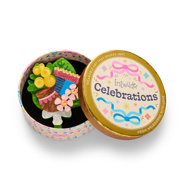 layered acrylic resin pink, blue yellow, green, and white floral bouquet brooch, shown in illustrated round gift box packaging.
