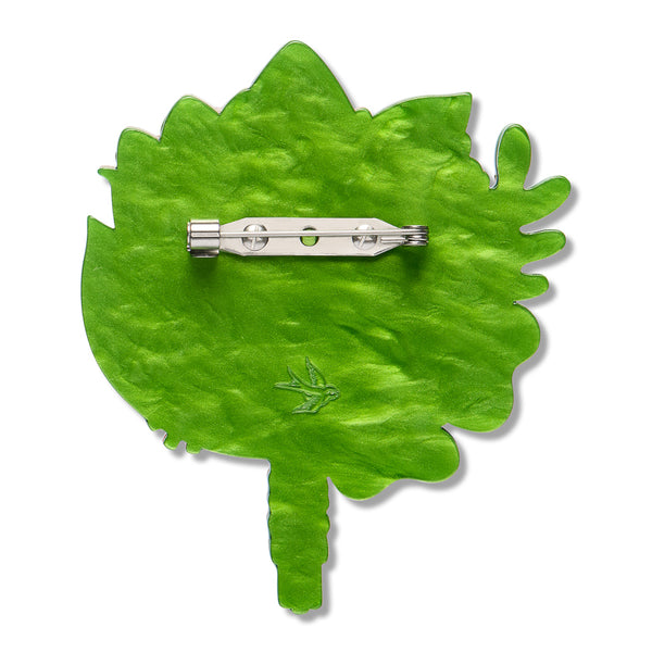 solid green back layer of layered acrylic resin floral bouquet brooch with silver metal pin clasp