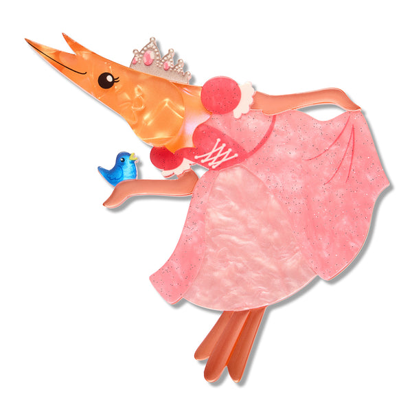A shrimp-shaped layered acrylic resin brooch with a pink glittery dress, small tiara, and a blue bird accessory, isolated on a white background.
