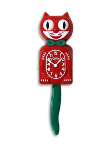 red, white, and green  Kit-Cat wall mount clock features a mischievous grin, and big round eyes that swivel side-to-side in time with its pendulum tail 