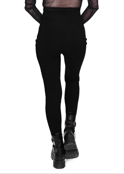 Model wearing black cotton modal blend leggings with high waistband and corset-style lace-up front detail. Shown from back