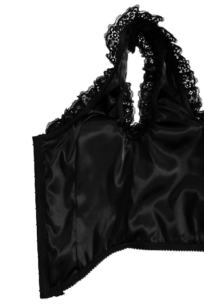 black cotton twill corset top with metal hook and eye fasteners down length of bodice, flexible boning, and scoop neck with black floral lace trim. Shown flat and open to display black satin lining