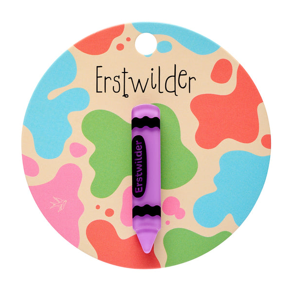 purple with black details acrylic resin "Erstwilder" brand crayon-shaped mini brooch, shown on colorful backer card packaging