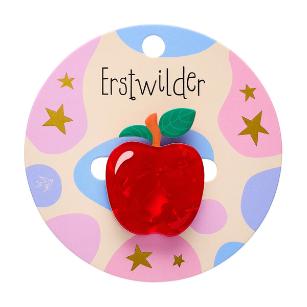red apple with green leaves acrylic resin brooch, shown on "Erstwilder" branded backer card