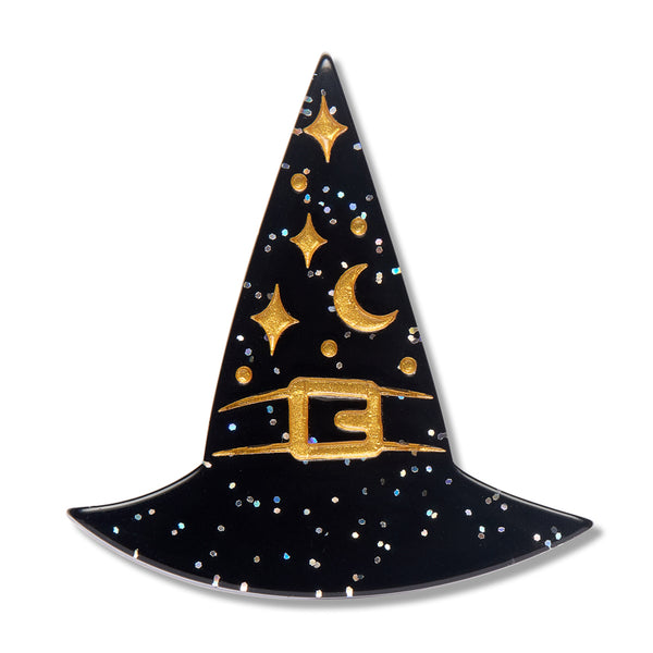 A glitter black witch hat acrylic resin brooch decorated with gold glitter stars, a crescent moon, and a gold buckle, shown on a plain white background.
