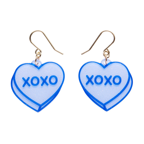 pair of blue glitter resin candy heart dangle earrings with 'XOXO' text 